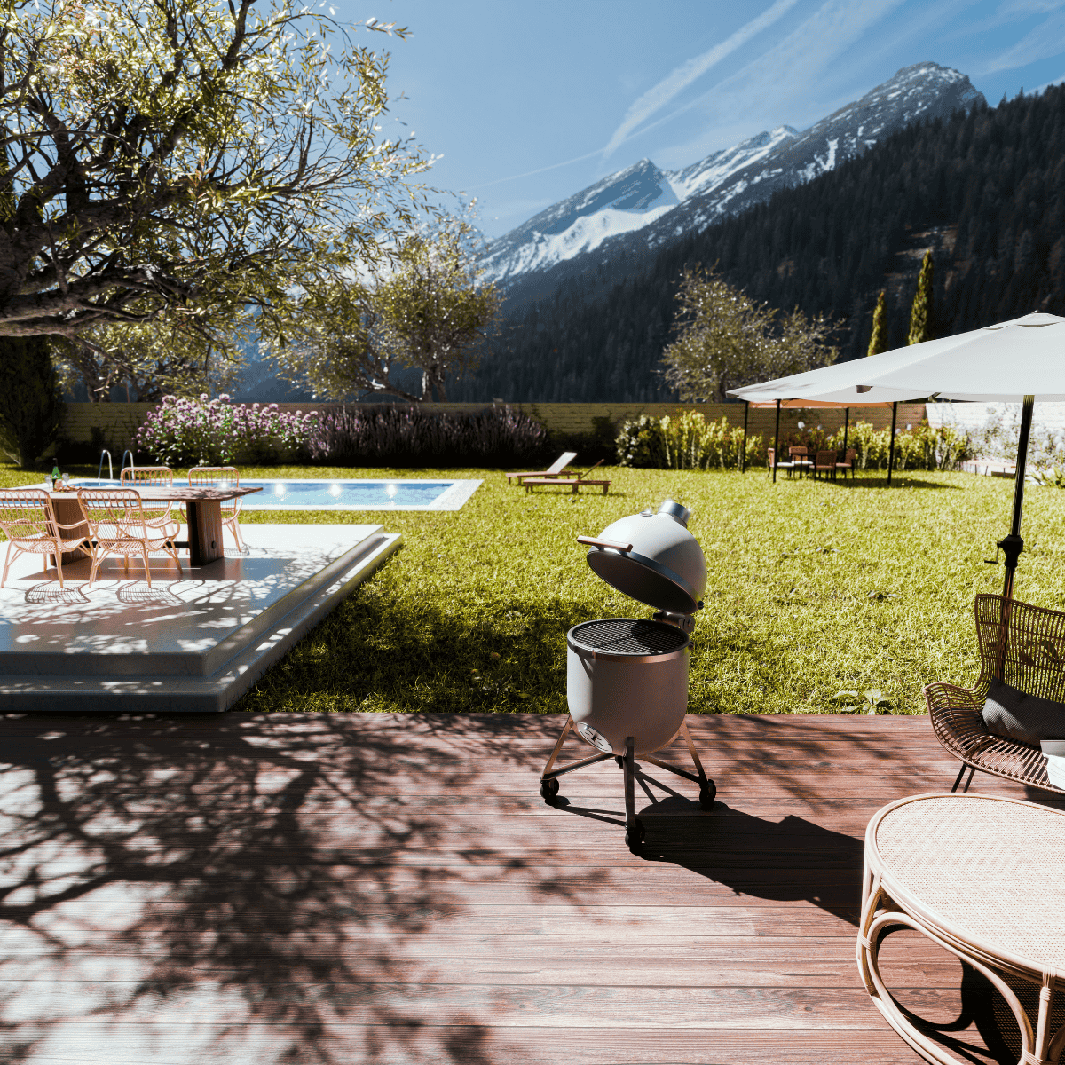 Der Compadre Grillofen auf einer luxuriösen Terrasse vor einer Berglandschaft aus der Ferne